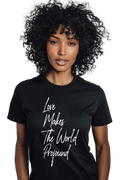 Person wearing a black t-shirt with 'Love Makes The World Profound' text on a plain background