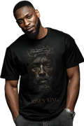 Man wearing a black t-shirt with 'Risen King' graphic design on a white background
